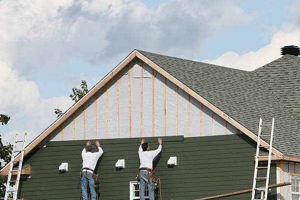 Professional Siding technician working in Remington, IN